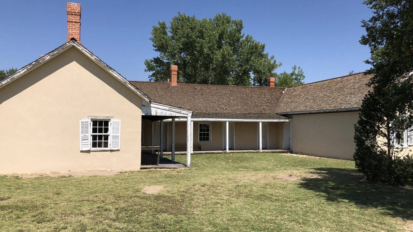 A U-shaped adobe house