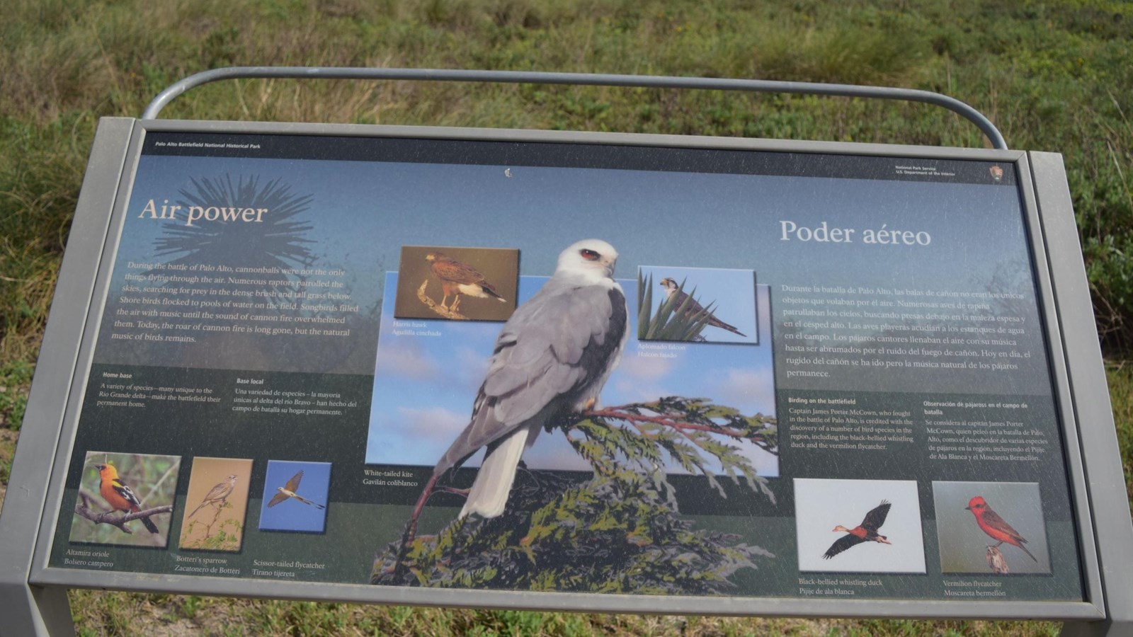 A low-profile cantilever wayside base in grey weathering steel for a 36”x 24” interpretation panel. 