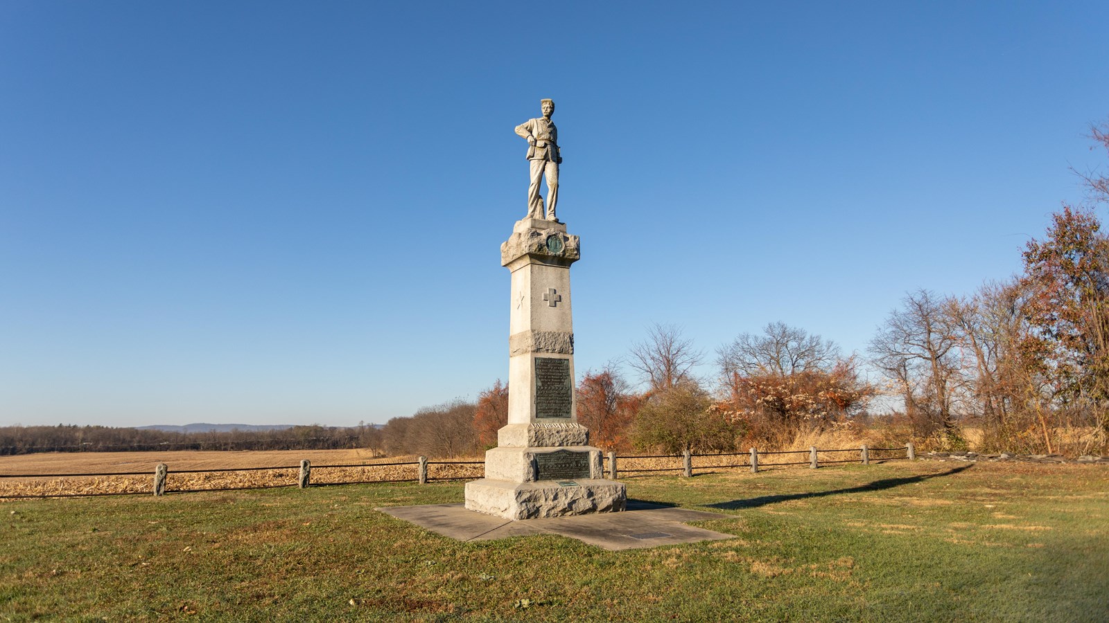 A white marble sculpture of a soldier. 