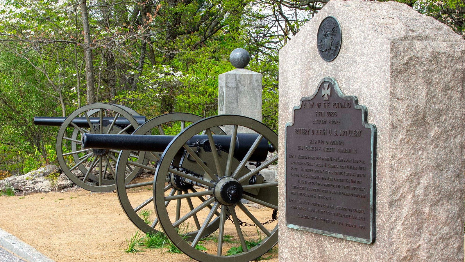 A stone monument near cannon.