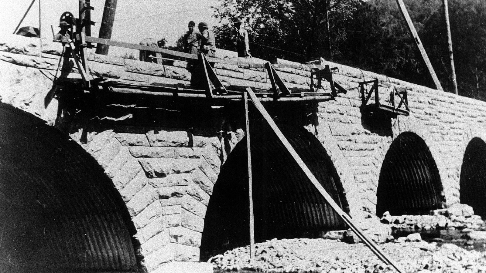 Black and white photo of an historic four-arch bridge built in 1939-1940 by the CCC