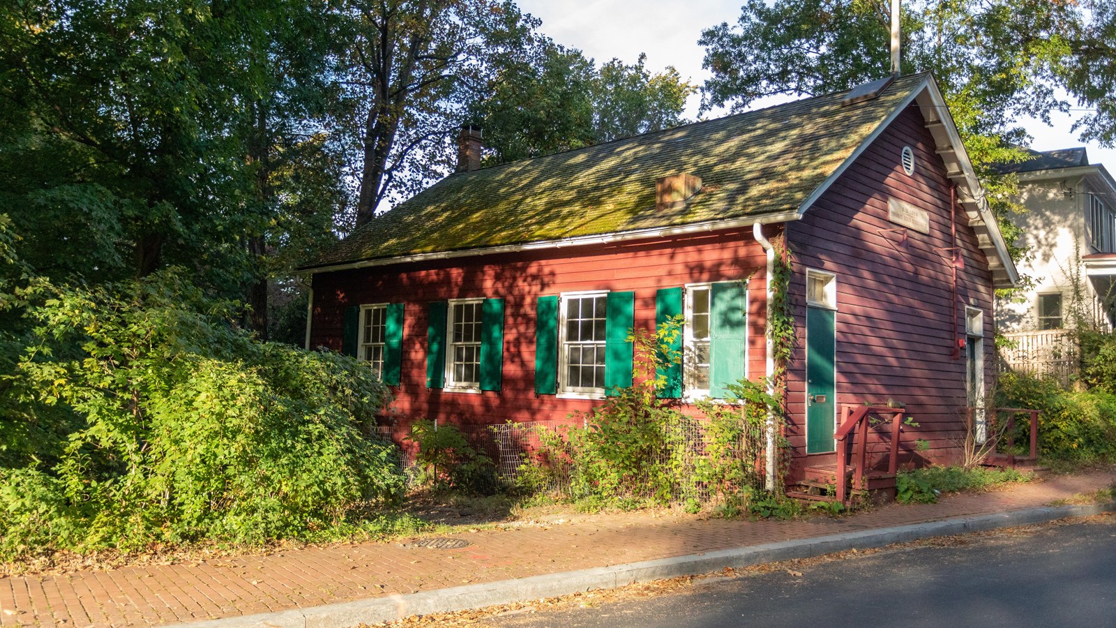 A red house in the woods.