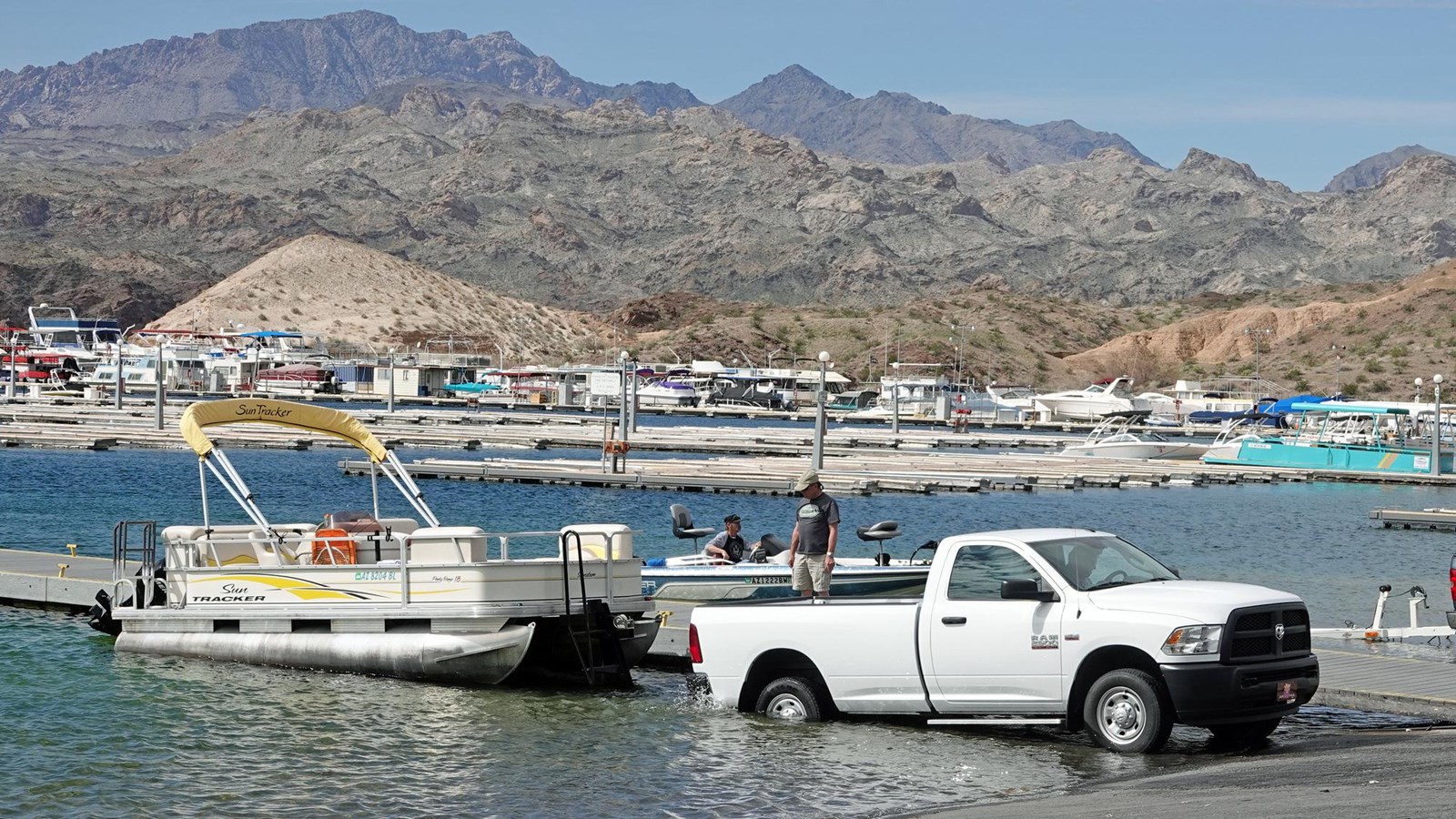 A boat being launched into a large body of water