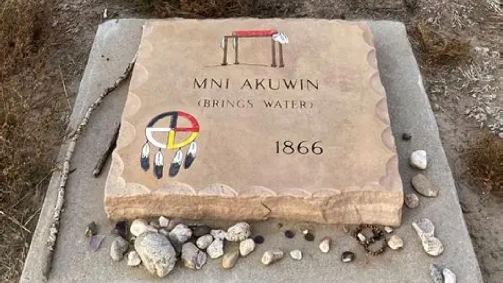 A stone plaque with the words 