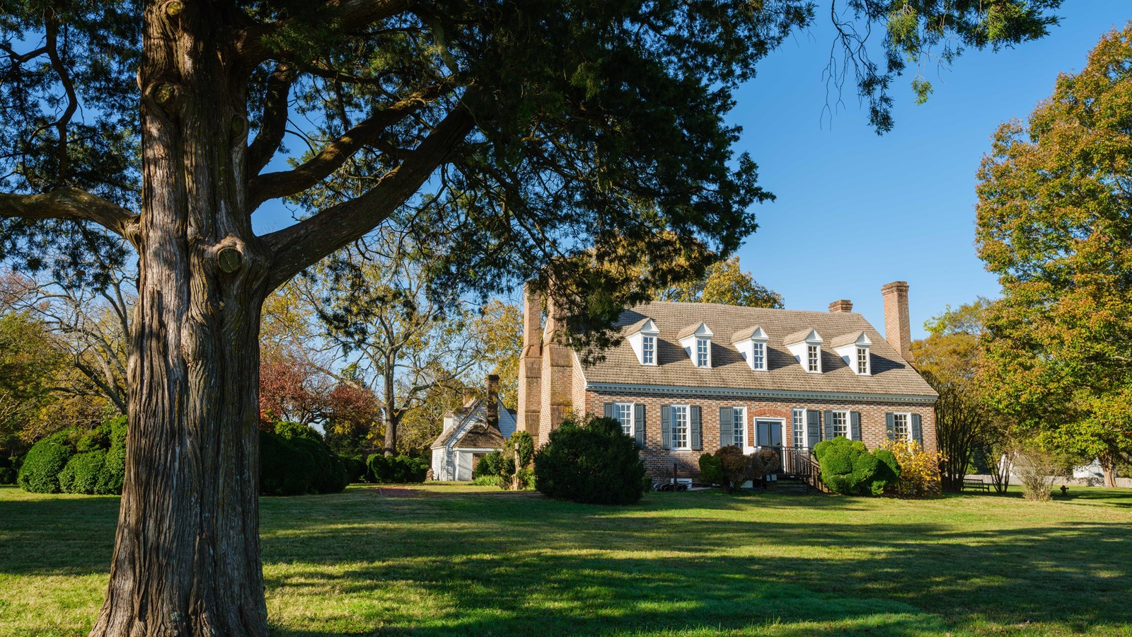 brick two story house with dormers