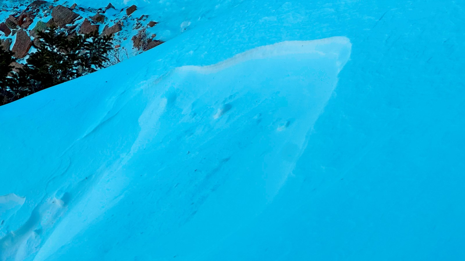 Natural avalanche snow slide on a slope