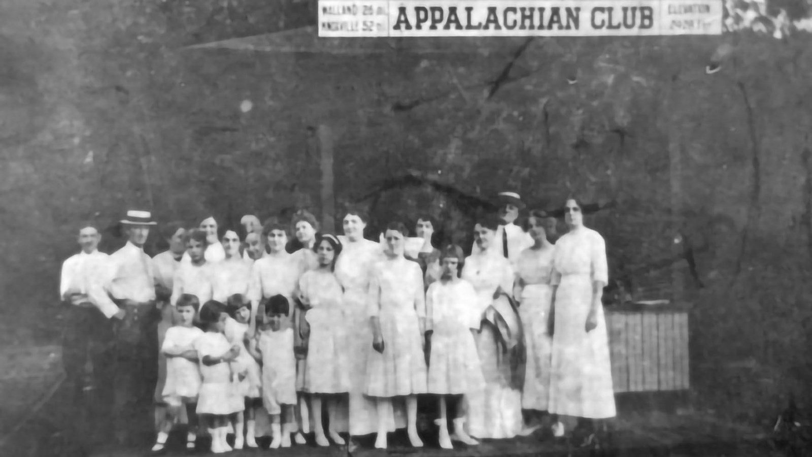 Black and white image of residents standing at the Appalachian Club Depot