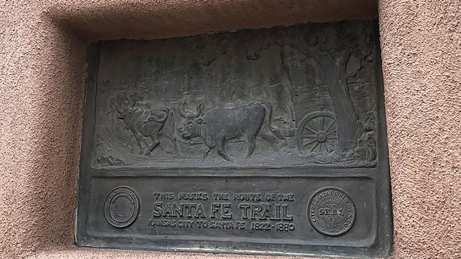 A bronze plaque marking the route of the Santa Fe Trail