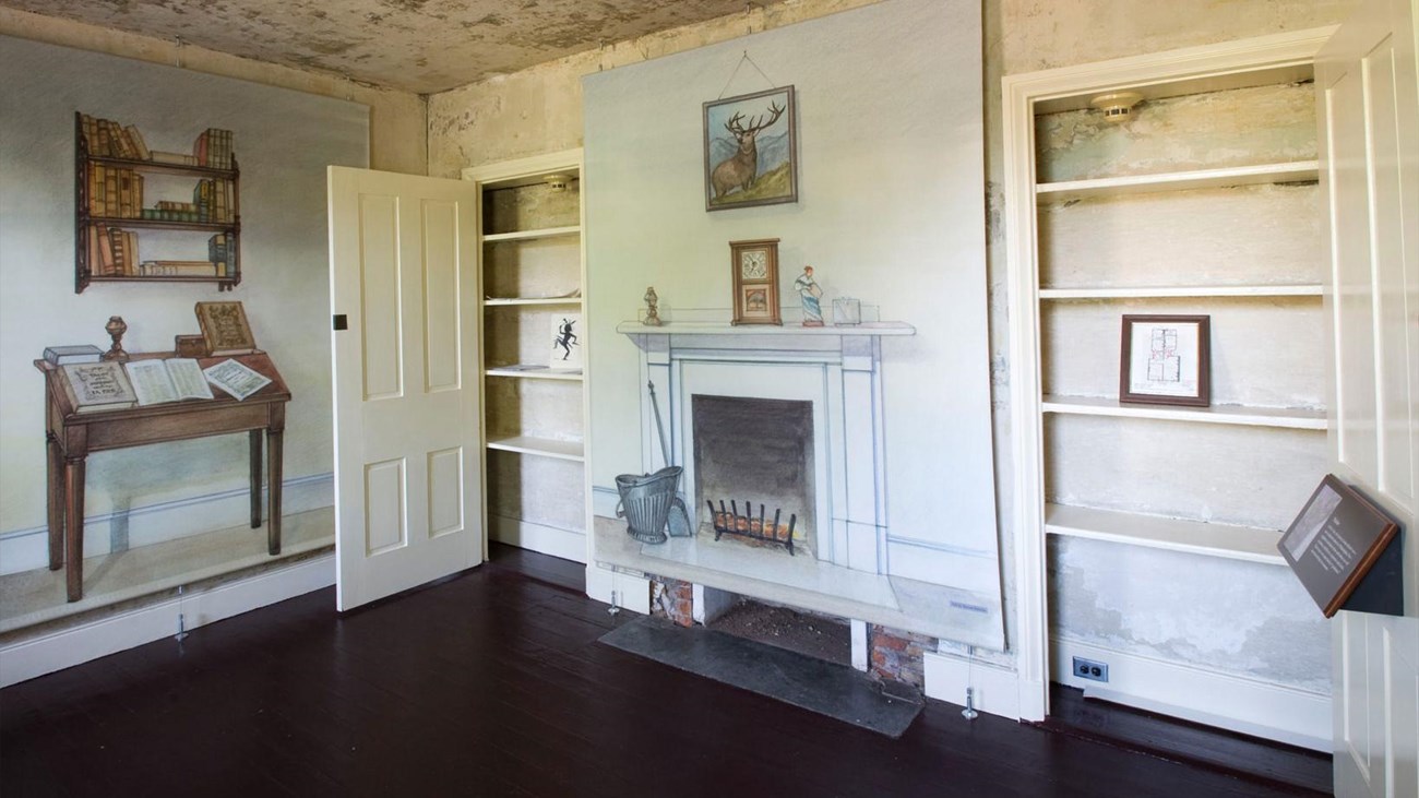 The parlor in the Poe House, a small room with illustrations of furniture but no real furniture.