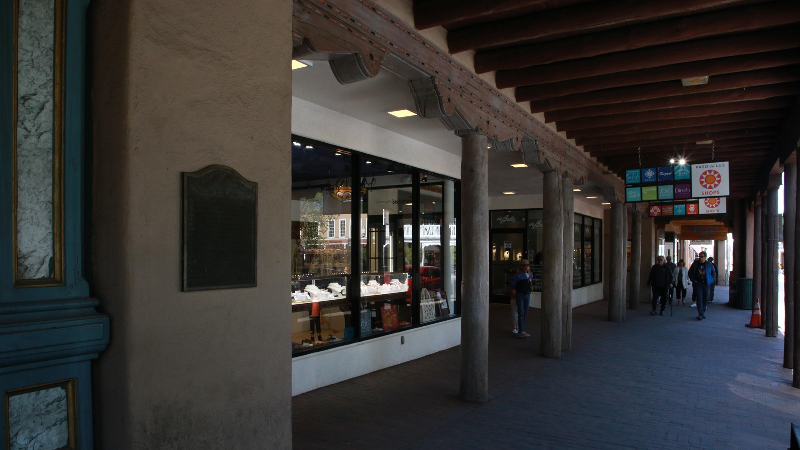A large pink adobe building with a large front hacienda.