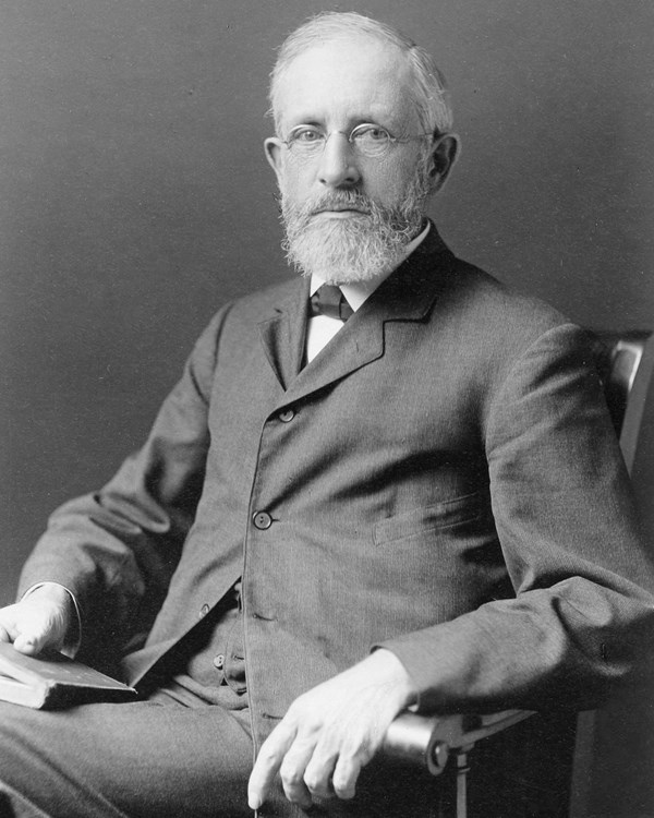 A black and white photo portrait of William Poole Bancroft sitting in a chair.