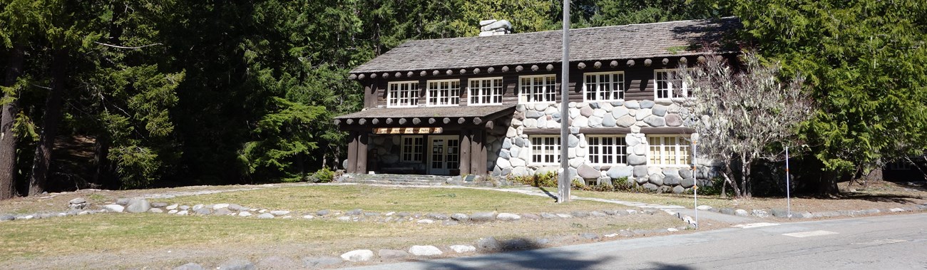 A two-story wood and rock building.