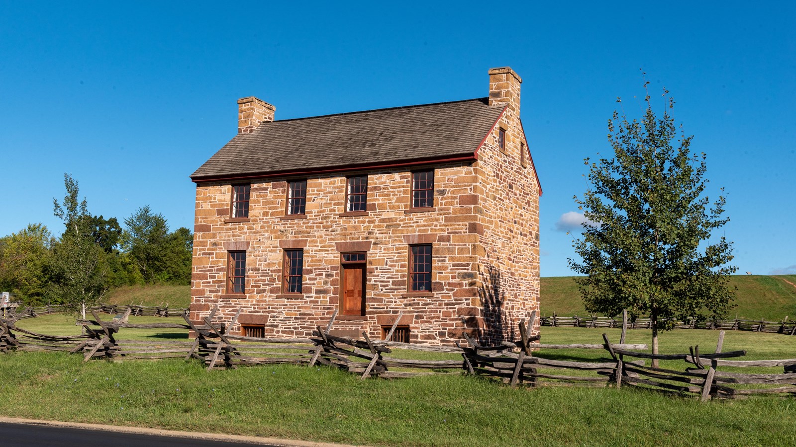 A large two story stone house 