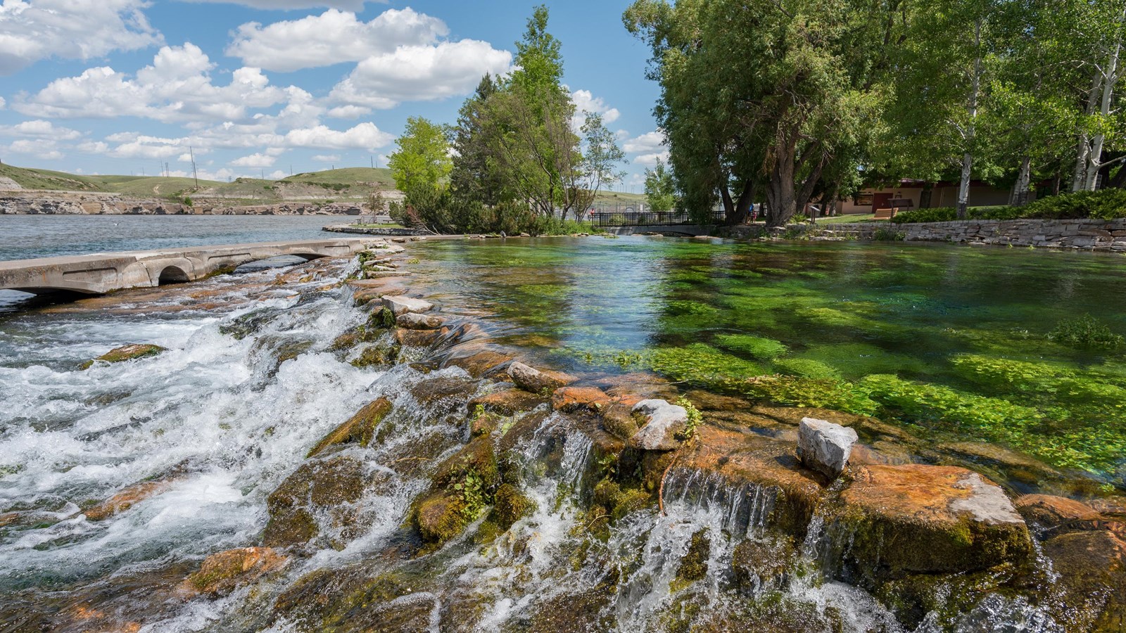 water spring with clear water and green underwater features