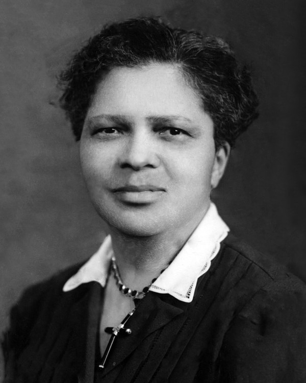 Black and white portrait of an African-American woman with short hair.