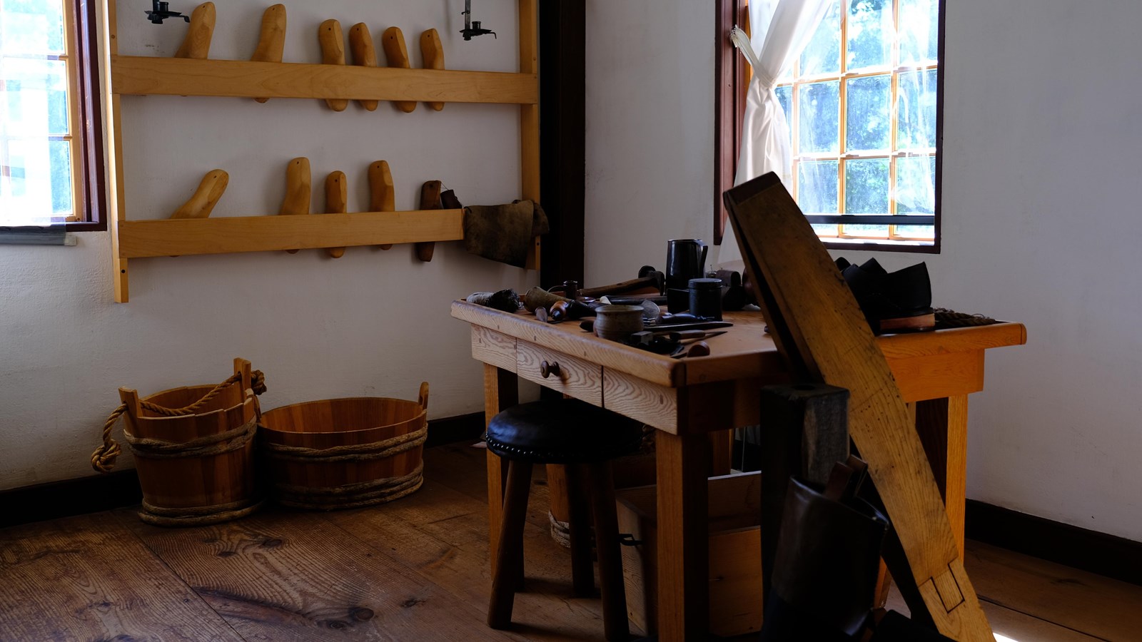 Small room with work bench and cordwainer\'s supplies