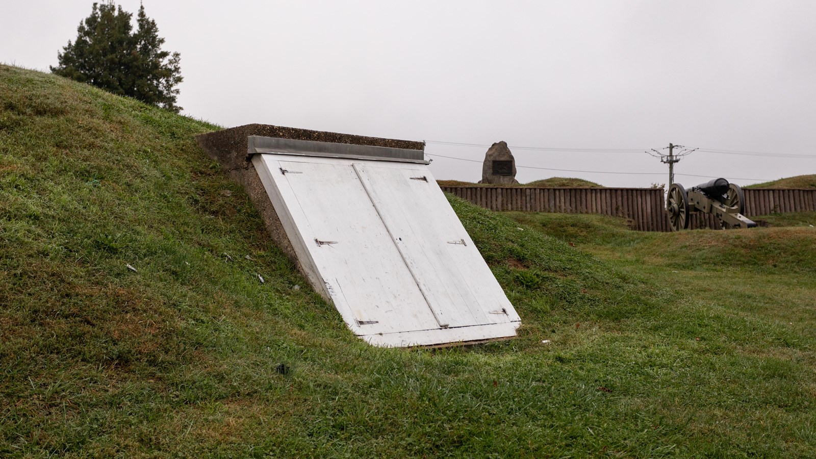 White doors on the side of a hill.
