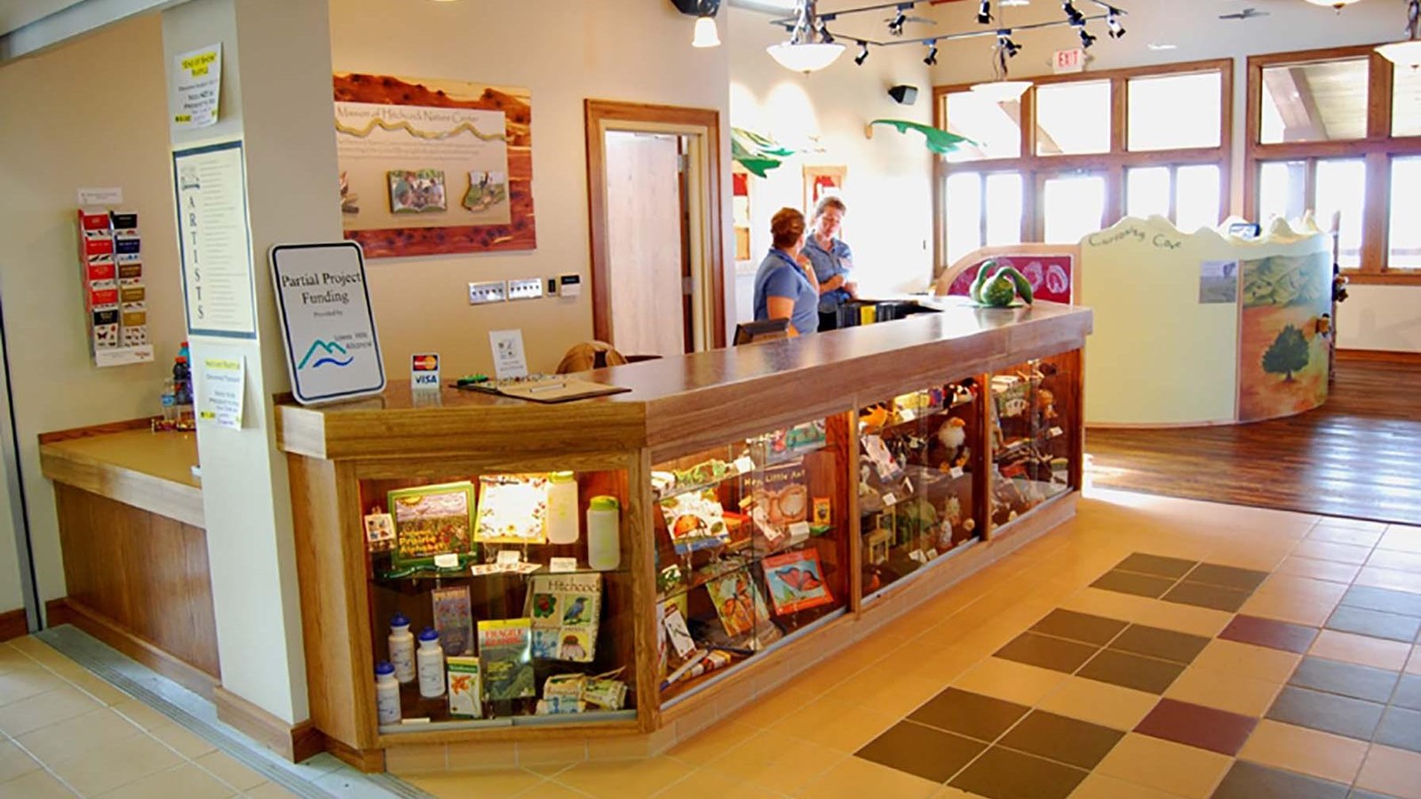 Front desk with two women standing behind 