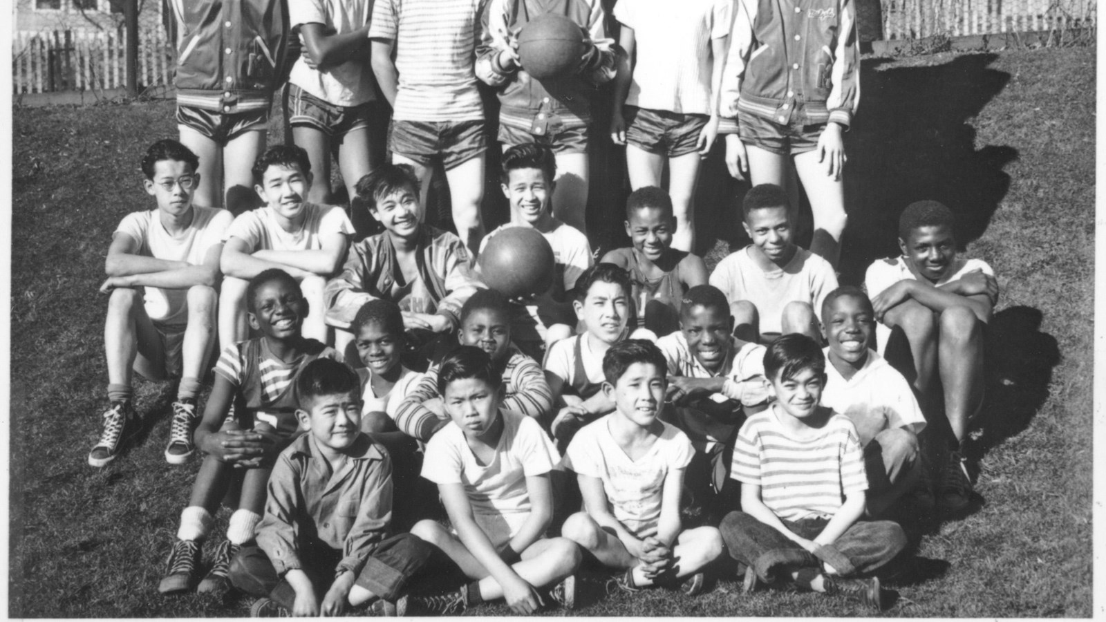  The group is diverse, with different ethnicities represented, and they seem cheerful and relaxed.
