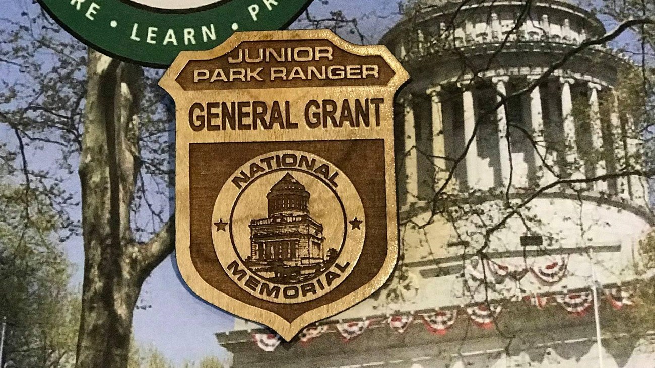 A General Grant National Memorial Junior Ranger booklet and wooden badge