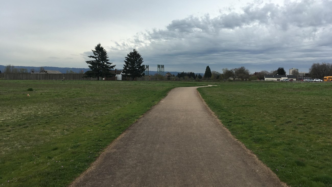 A paved trail leading towards Fort Vancouver.