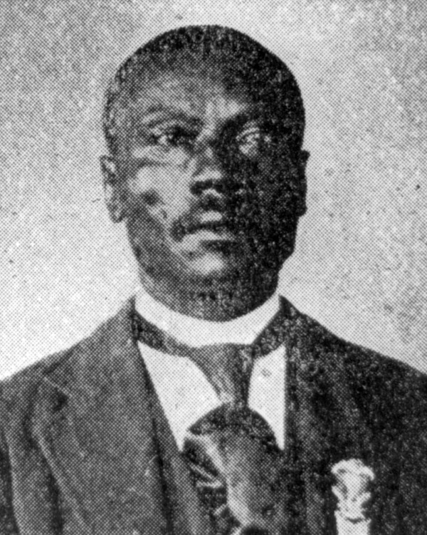 Black and White phot of African American man in a suit. Medal of Honor is on his jacket