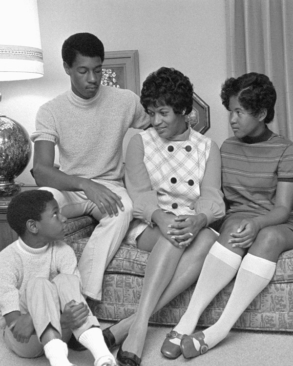 Black and white image of Myrlie Evers pictured with her children 