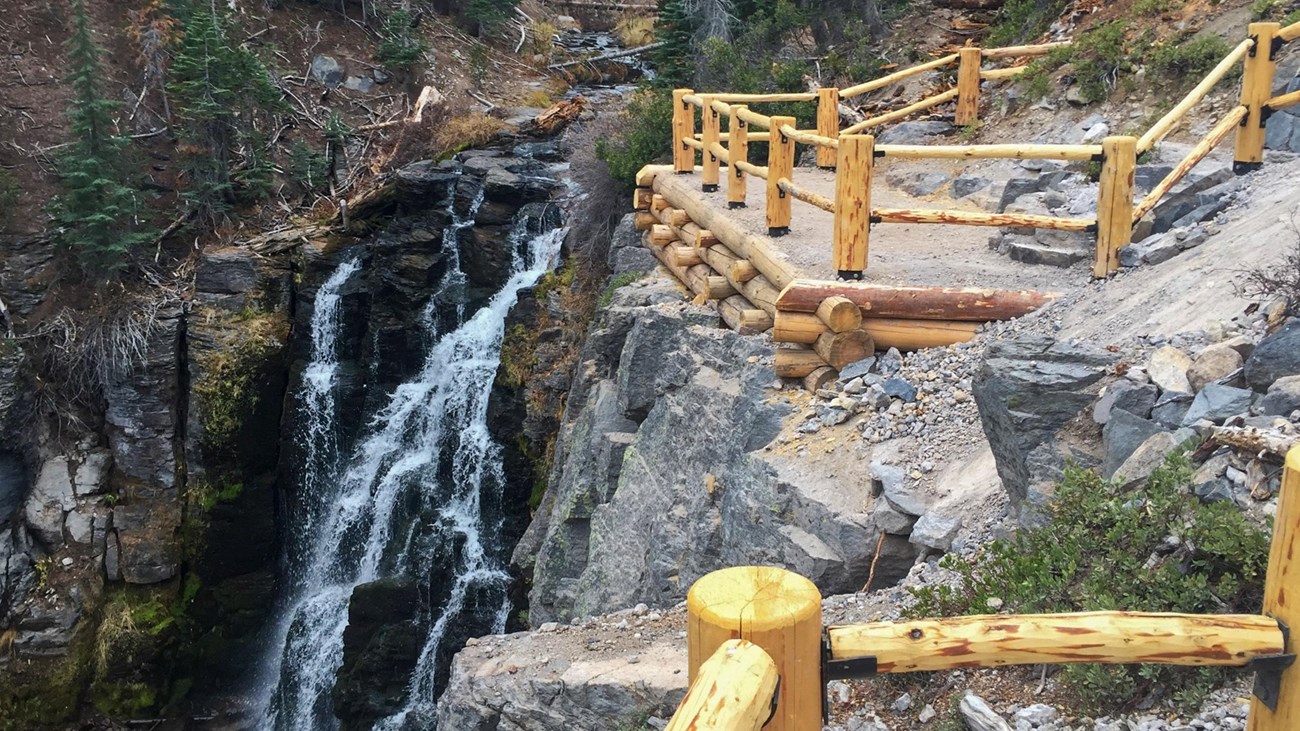 A fenced overlook above a 30-foot-high waterfall.