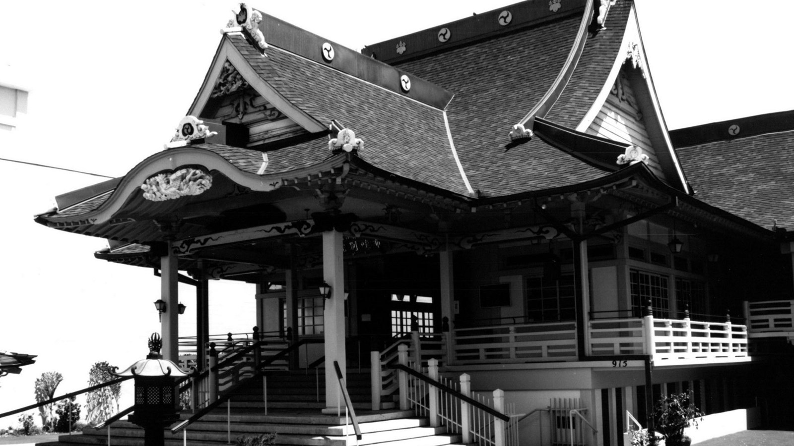 Temple building with sloped roof and statues outside