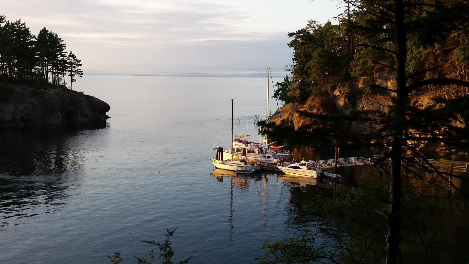 A picture of a boat docked in a snug harbor