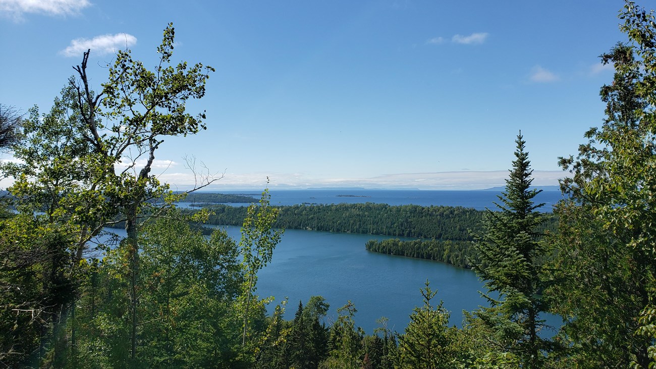The forested islands of Isle Royale National Park surrounded by Lake Superior. 