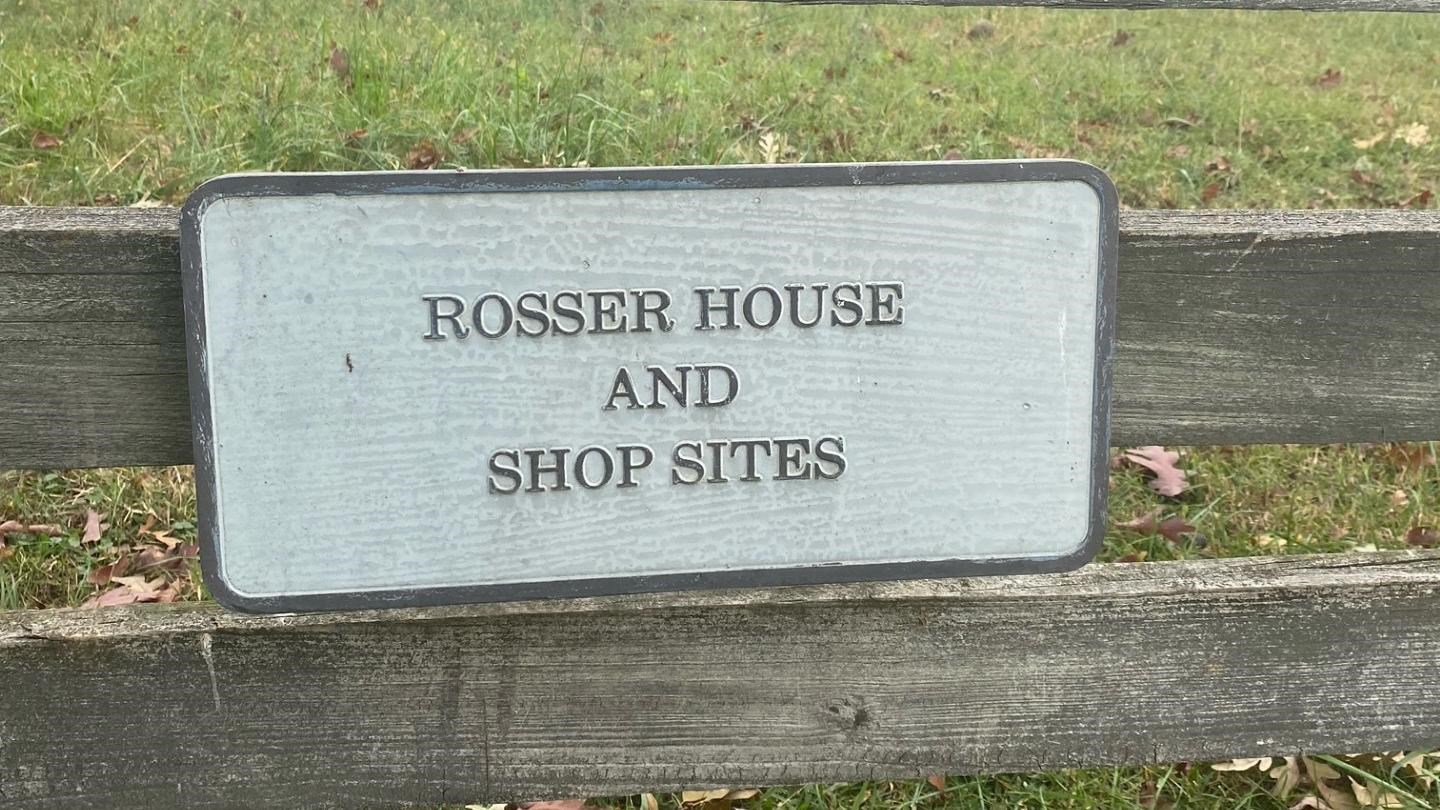 A metal sign reads 