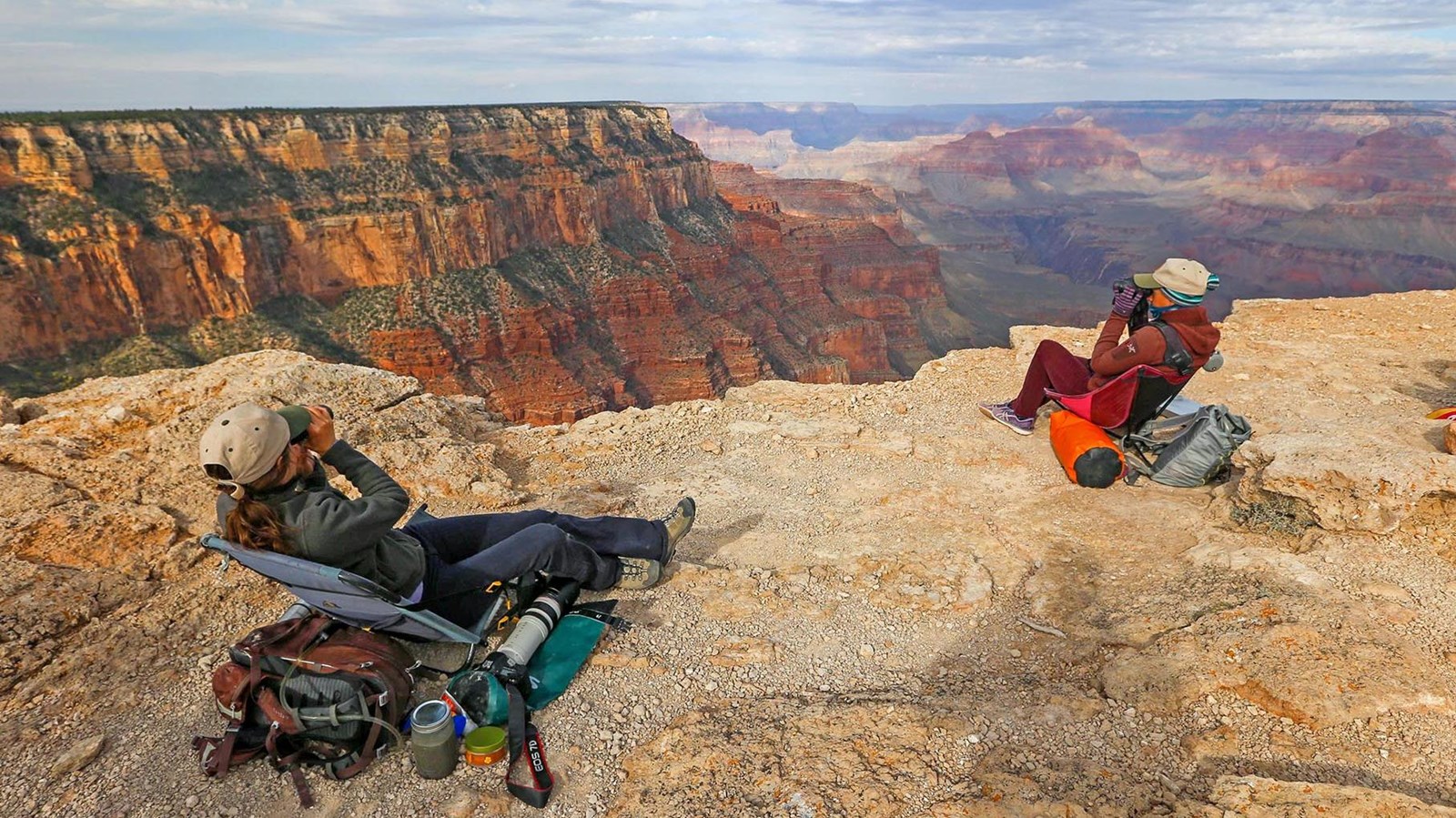  Two volunteers from Hawkwatch International recline in chairs near the edge of the canyon