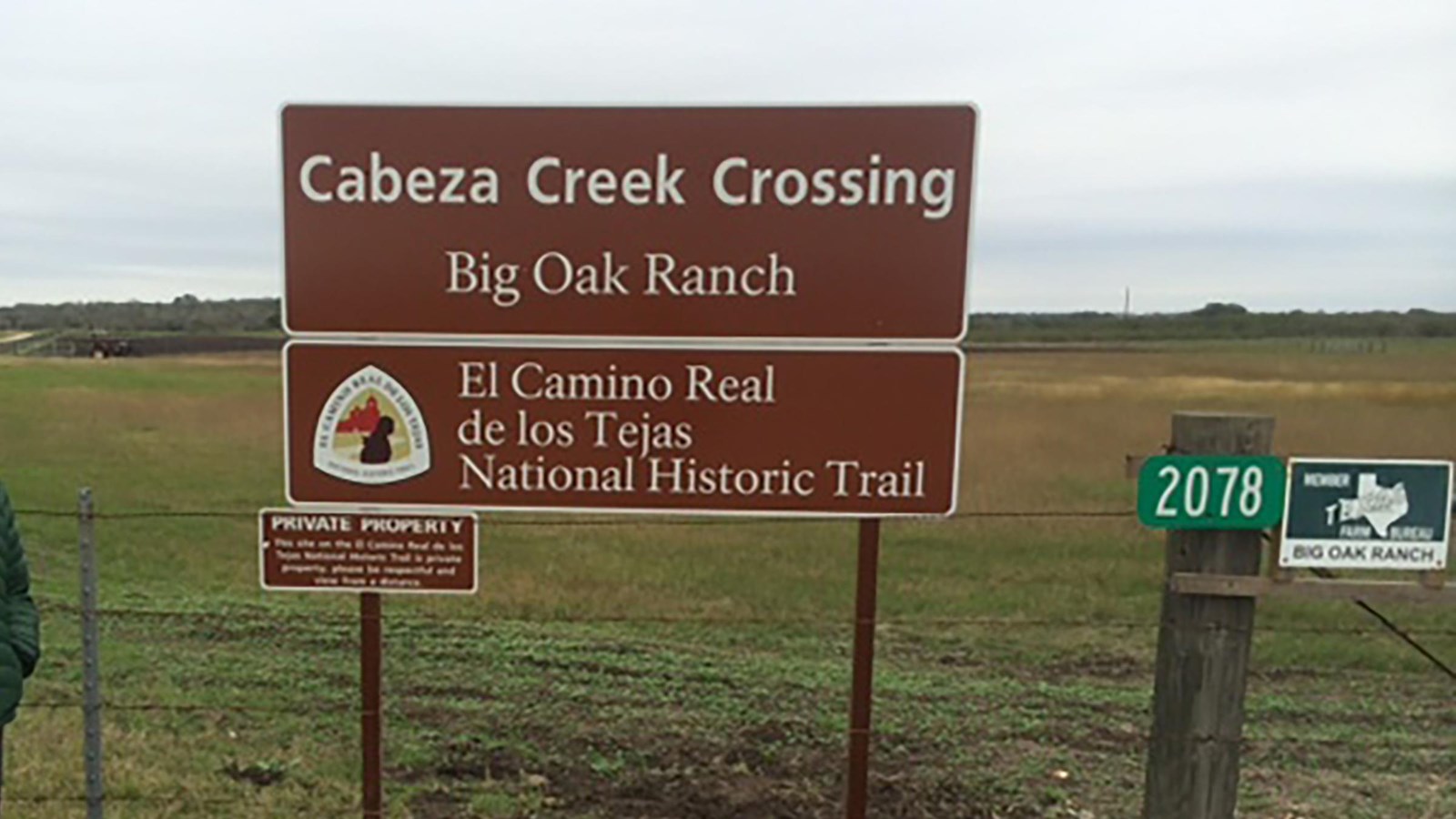 A large brown sign for