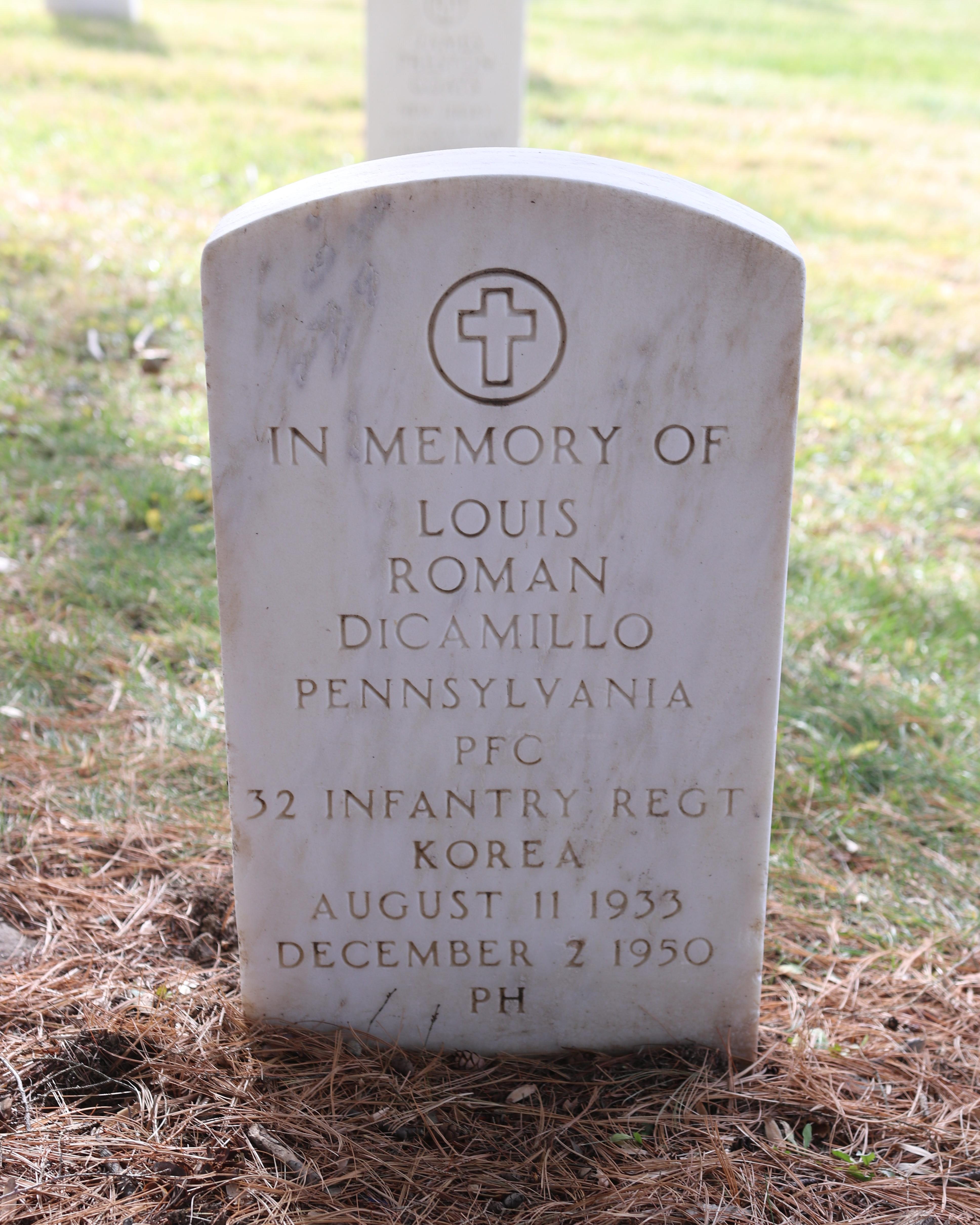 A white marble memory stone for PFC Louis DiCamillo