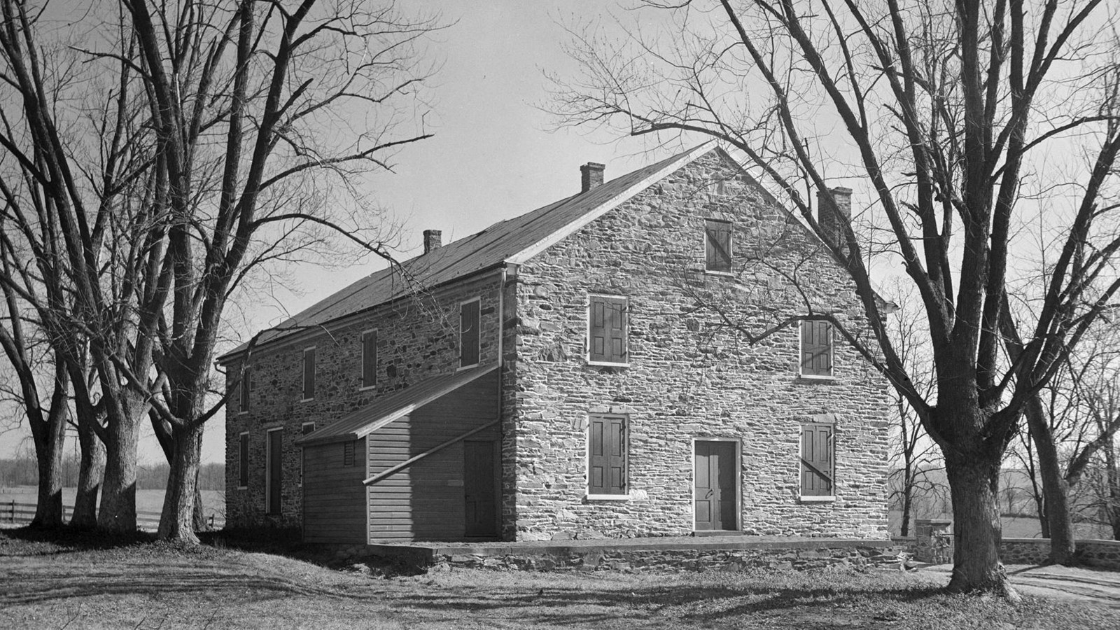 The Fairfax Meetinghouse is a two-story stone building located at the top of a small hill