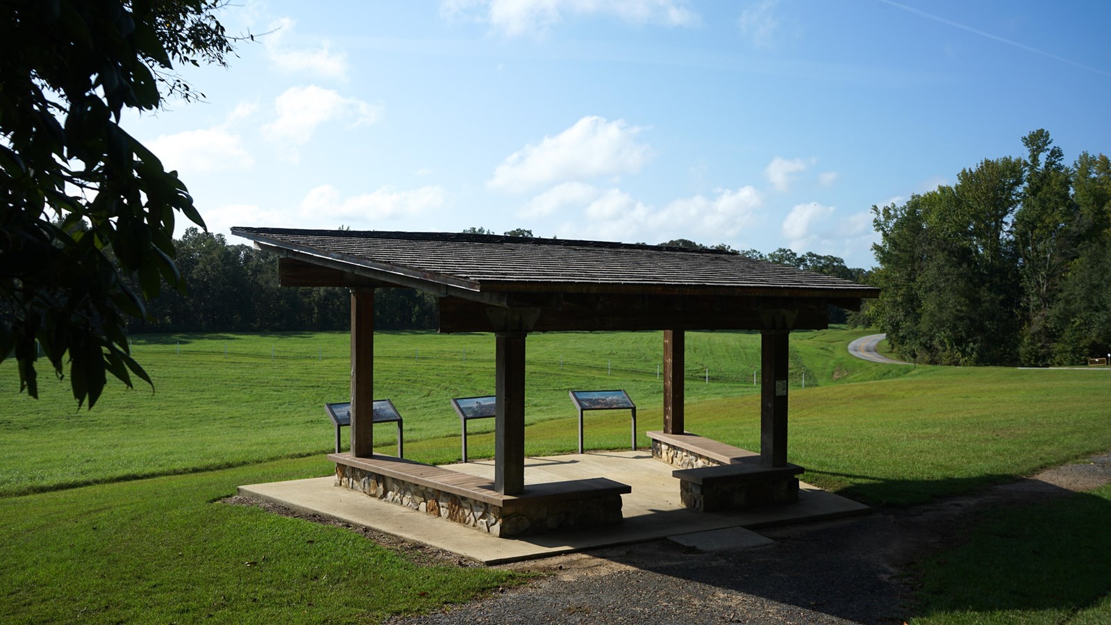 Image displays an informational wayside with an image of militiamen before battle.