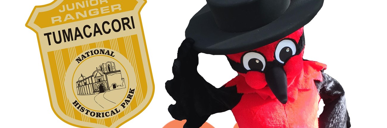 pancho the vermilion flycatcher with black hat, bowing, with silouette of church and junior ranger