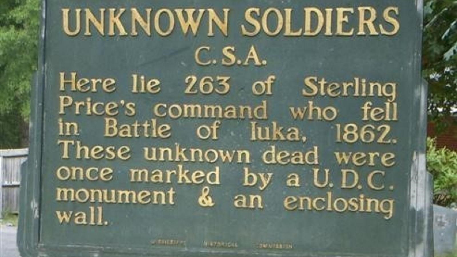 Green historic sign marking the Confederate Burial Trench