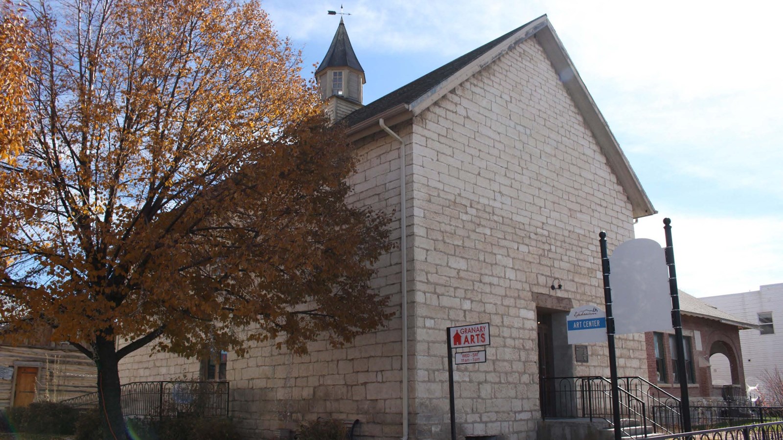2-story tall vernacular classical-style stone granary building, 50 feet long x 30 feet wide