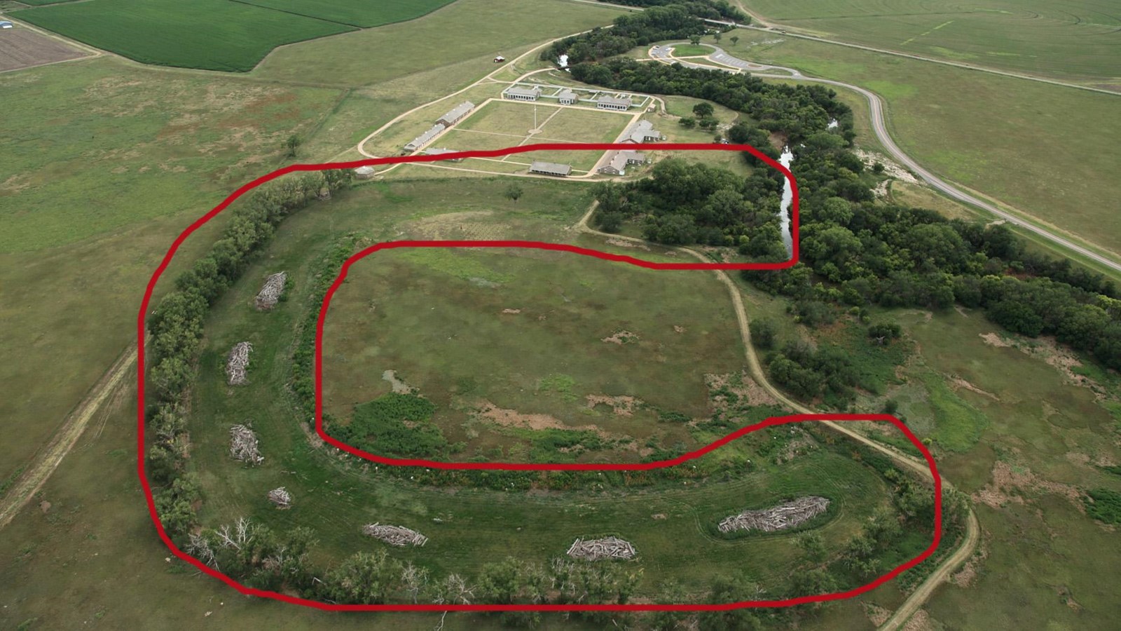 Aerial view of dry oxbow, outlined in red.