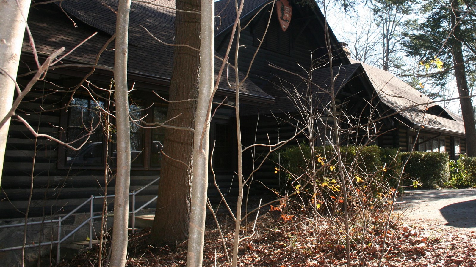 Photograph of the front of the Adirondack style lodge.