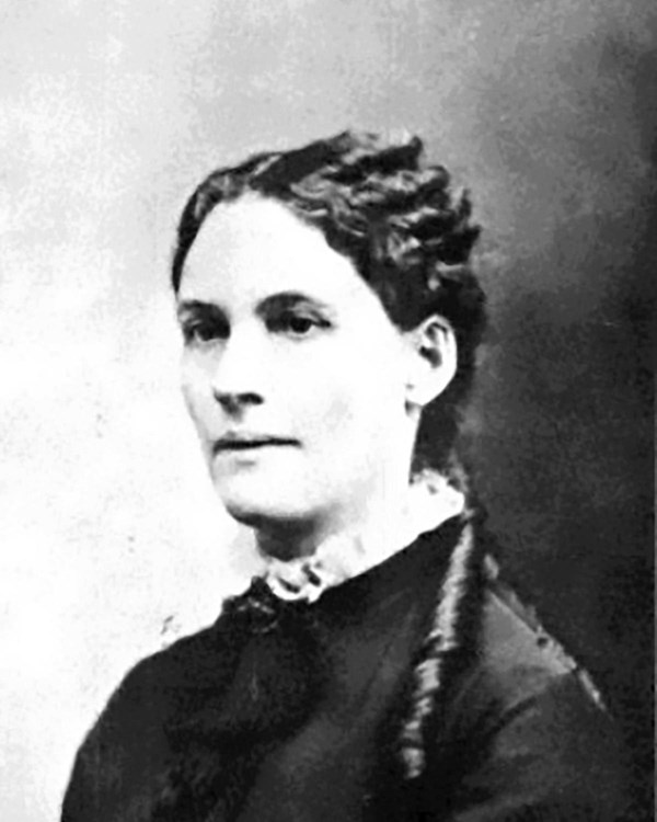 White woman wearing high-collared dress 