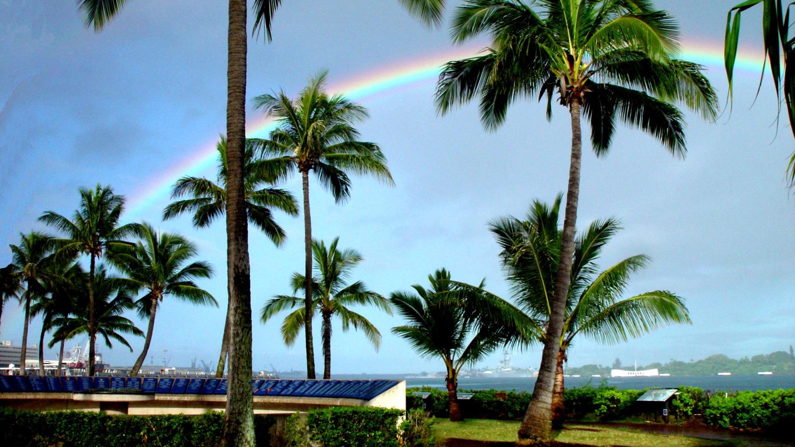 A Rainbow arches across the sky above Remembrance Circle