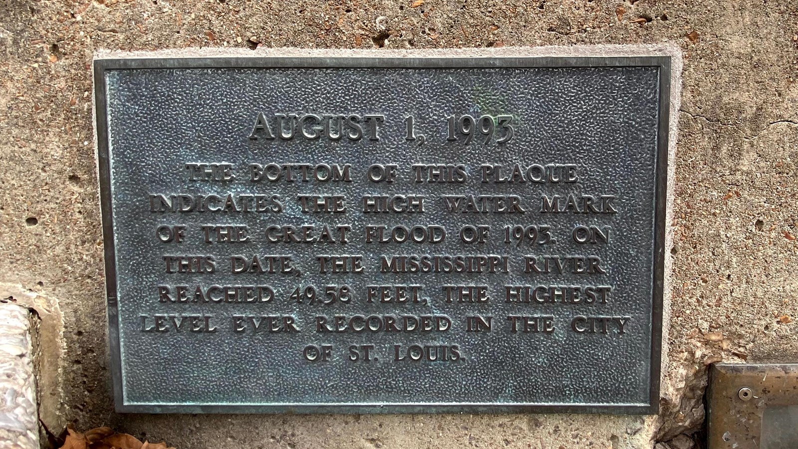 brass plaque marking the height of the water on the grand staircase in 1993