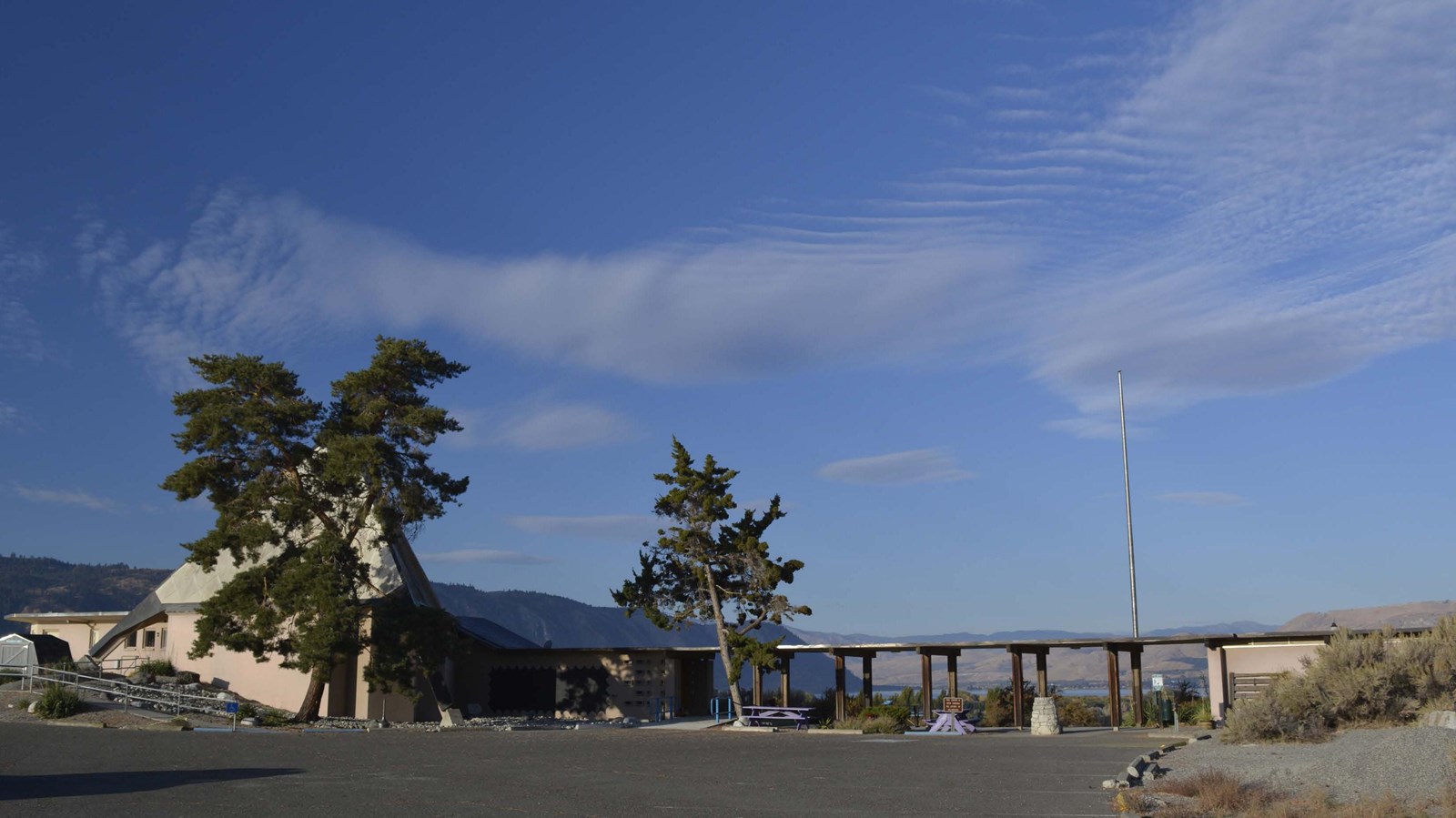 The Fort Okanogan Interpretive Center showing the large pyramidal roof and covered walkway 