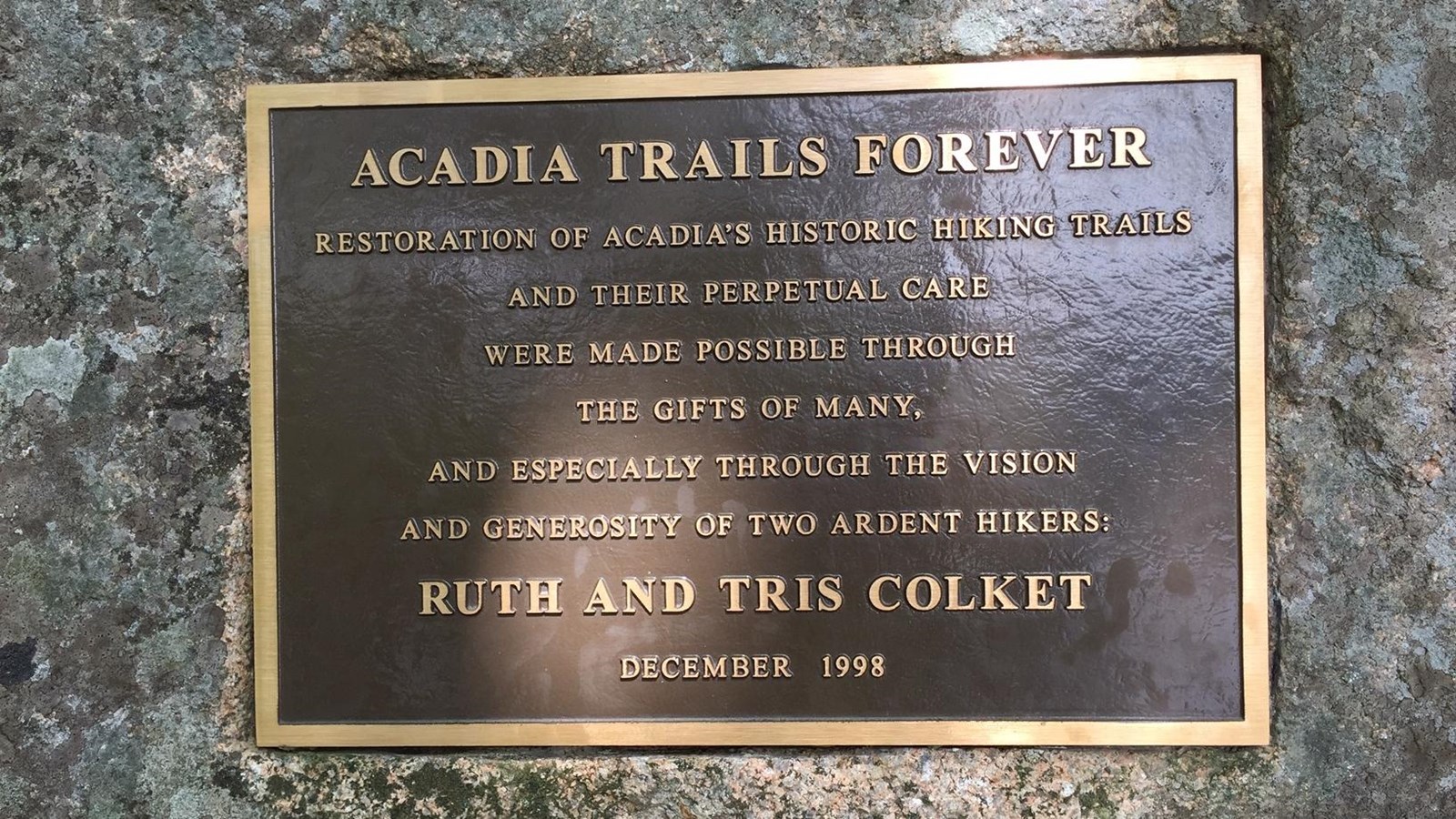 Bronze plaque on granite, inscription dedicated to Ruth and Tris Colket