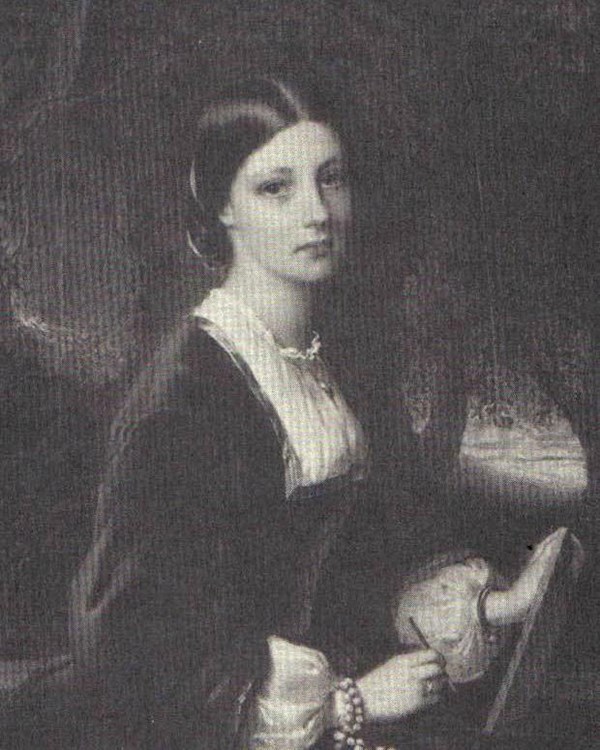 A black and white portrait of a young women.