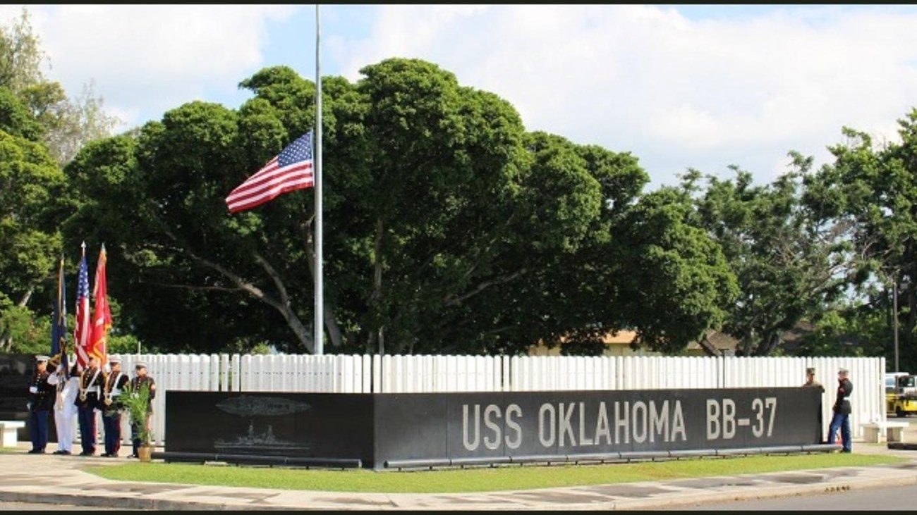 The flag flies full staff at the USS Oklahoma Memorial 