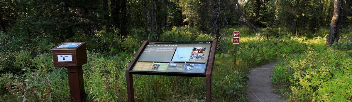 A sign at a trailhead.